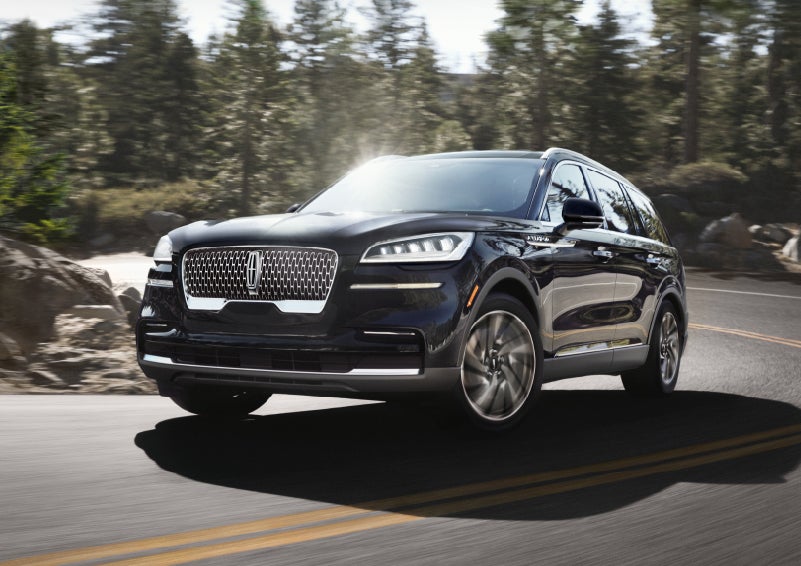 A Lincoln Aviator® SUV is being driven on a winding mountain road | Ed Morse Lincoln in Muscatine IA